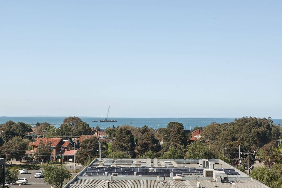 Views from the private balcony overlook Port Melbourne Beach.  
