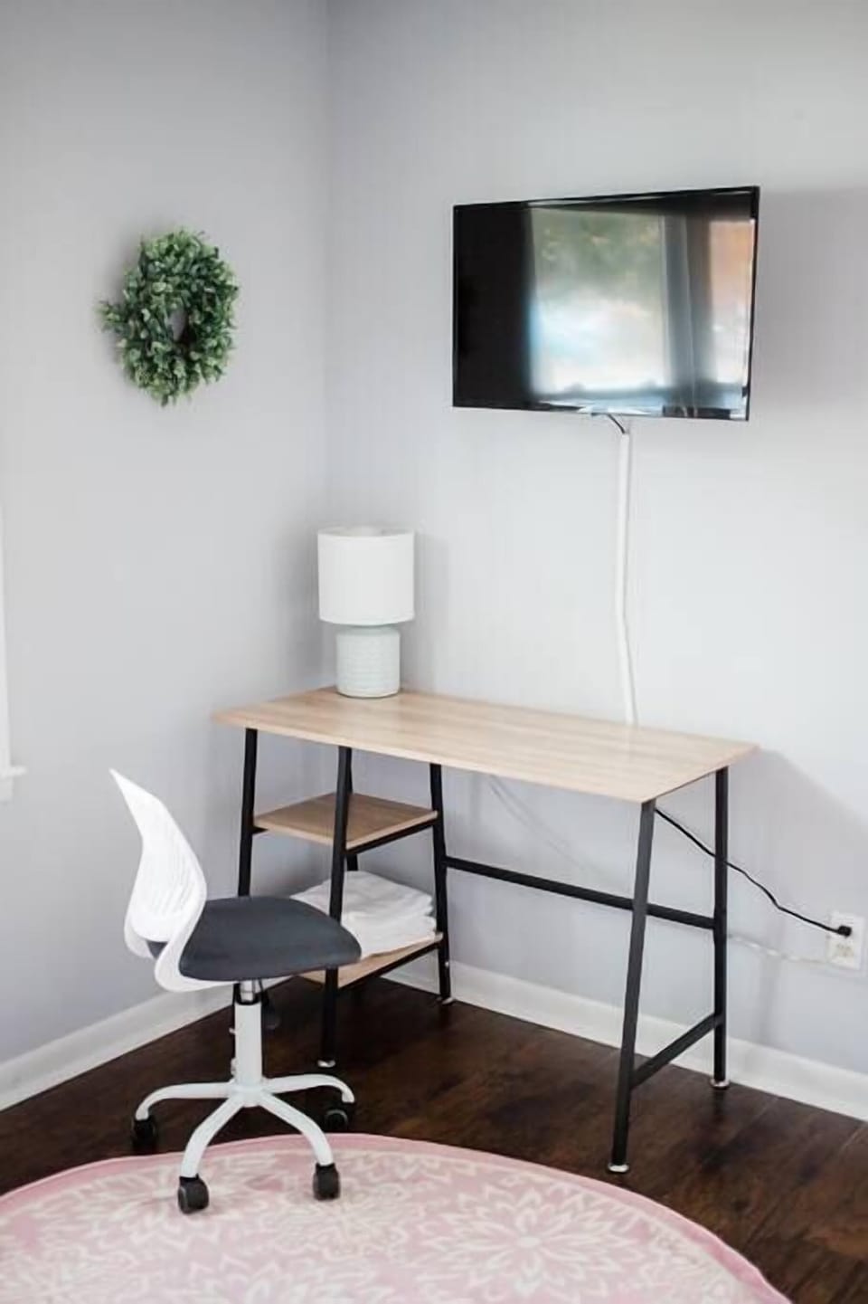 Has a workspace and TV.