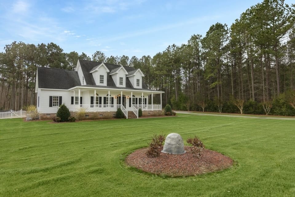 Elegant home with a timeless design and beautiful landscaping.