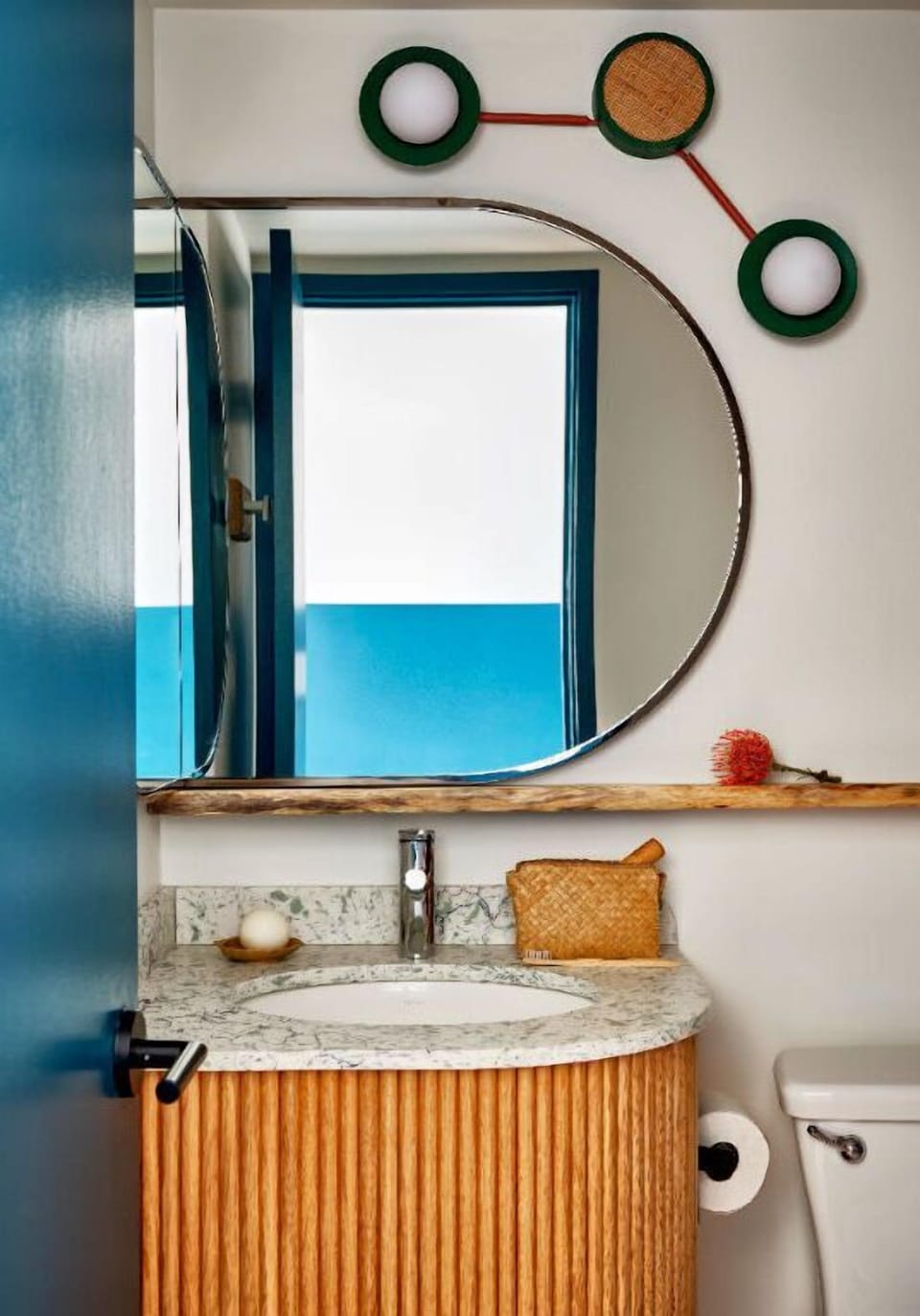 This modern bathroom features playful details and clean lines, creating a refreshing and inviting space for relaxation.