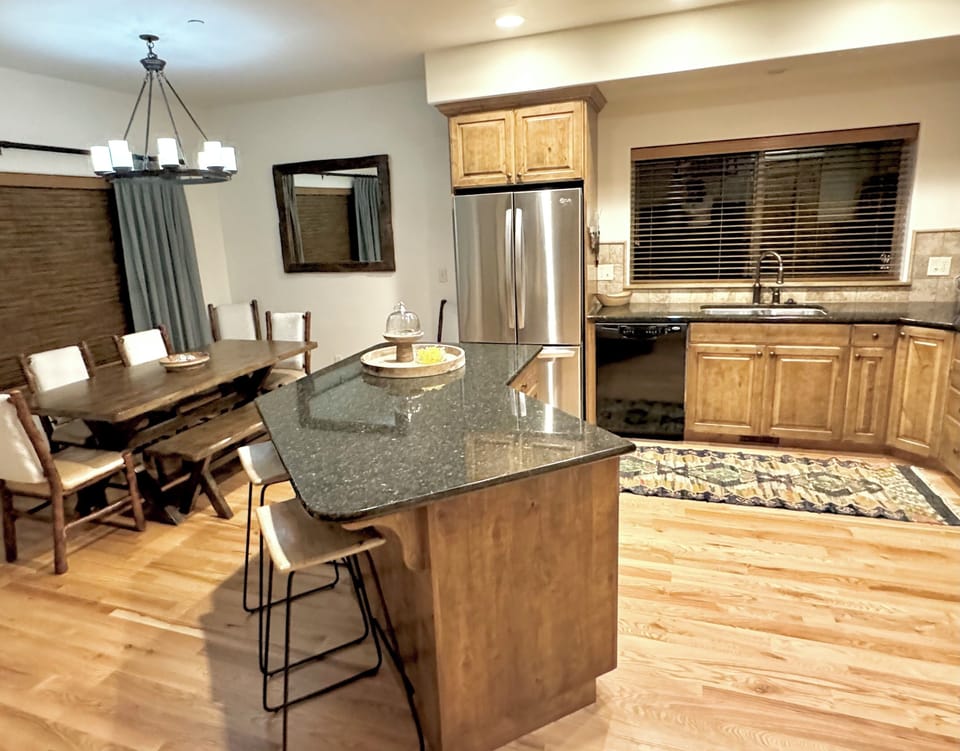 Comfortable space to dine, gather & share. Table for 8 + island counter sits 3