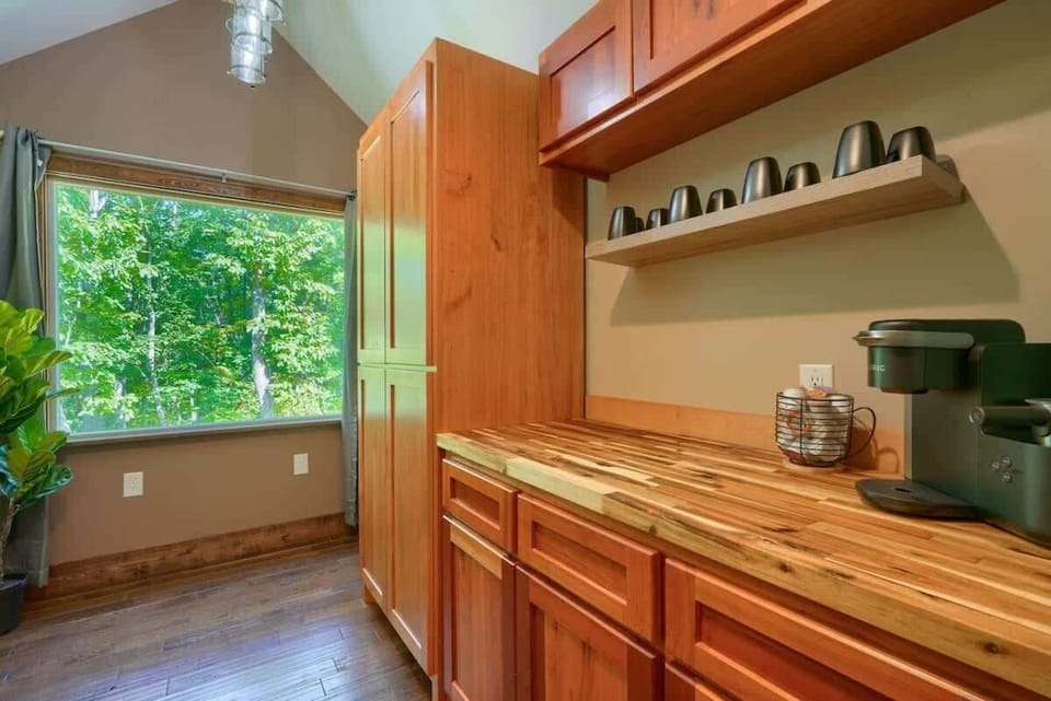 Kitchen Nook: Bright, spacious kitchen with natural views and chic wooden finishes awaits your culinary adventures!