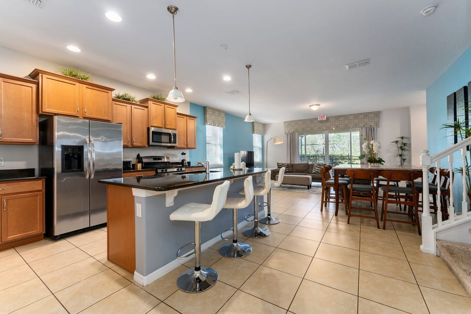 Kitchen showing modern fresh new kitchen and seating for 4 at the breakfast bar.
