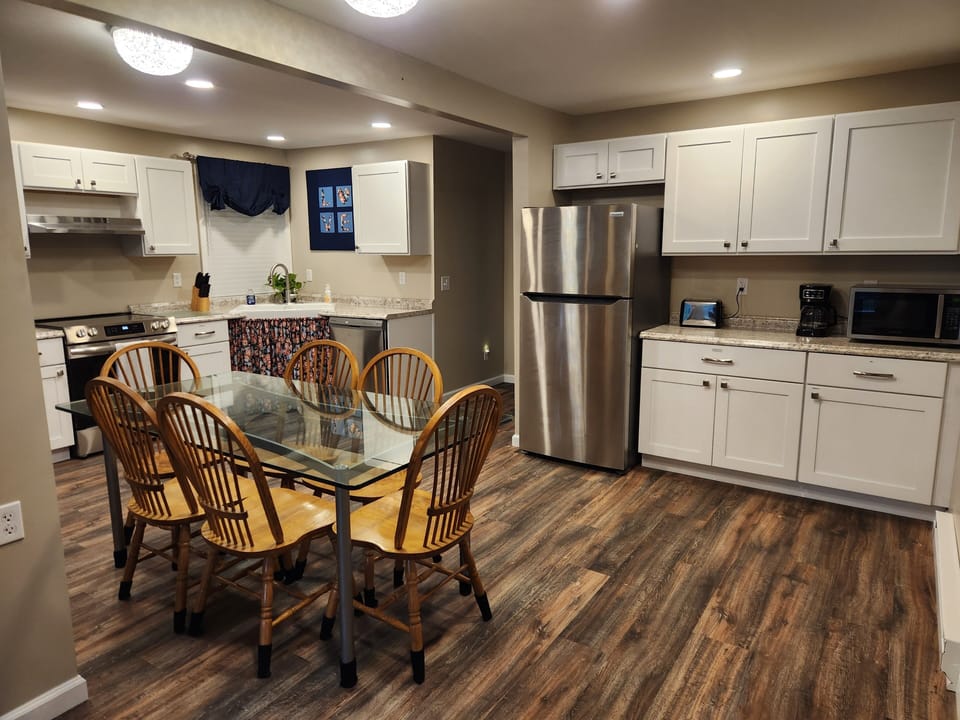 Dining area and kitchen are part of the open great room.
