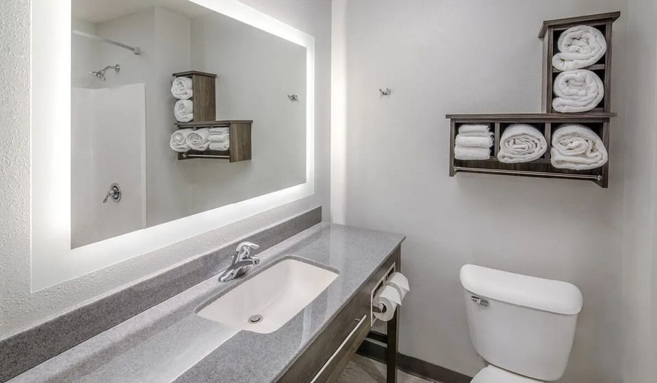 Rejuvenate with fluffy towels and a spotless, simple bath.