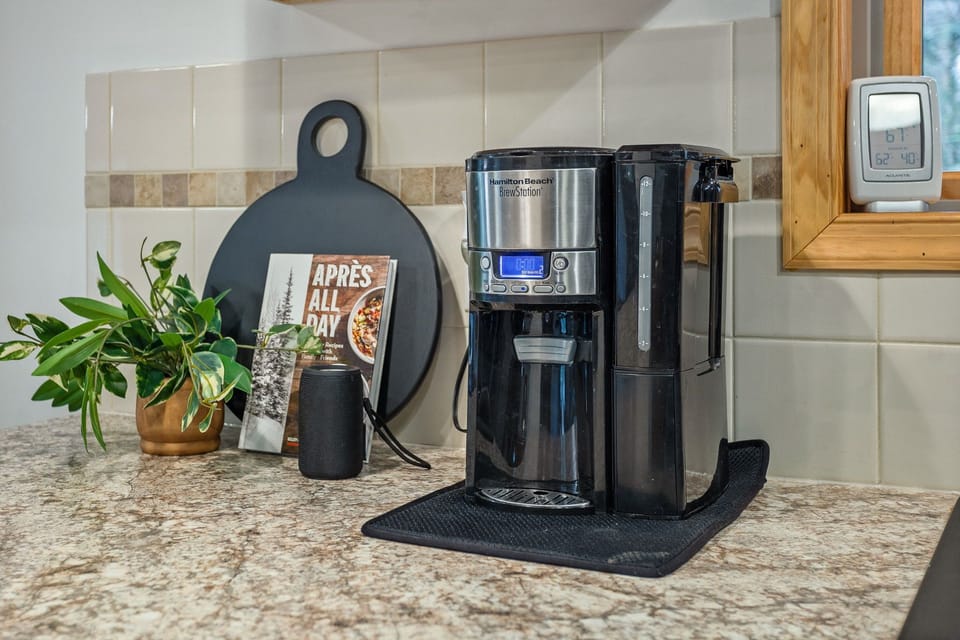 Wake up to your perfect brew at Hamilton Beach coffee station, featuring a drip coffee maker and complimentary coffee to fuel your day.