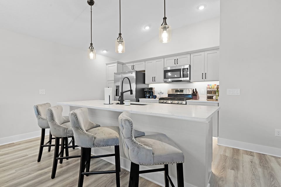 Kitchen Island with four plush bar top seating
