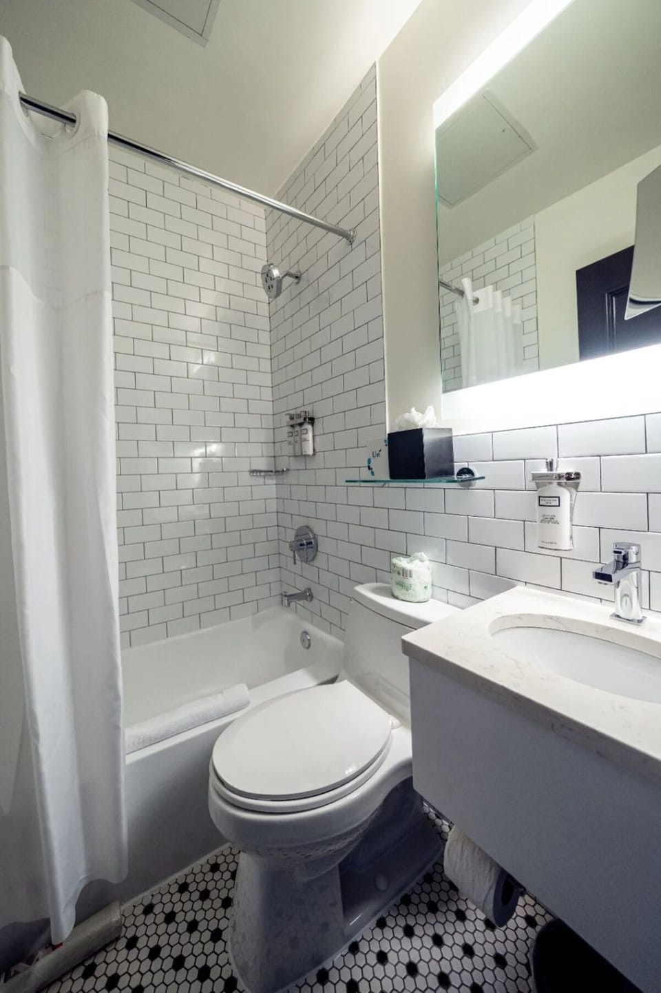 Refresh with bright subway-tile bath and spa-clean finishes.