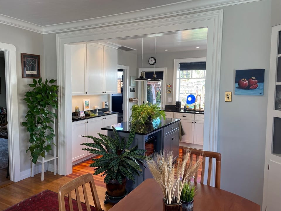 From dining room looking into kitchen and laundry room and out to the back deck
