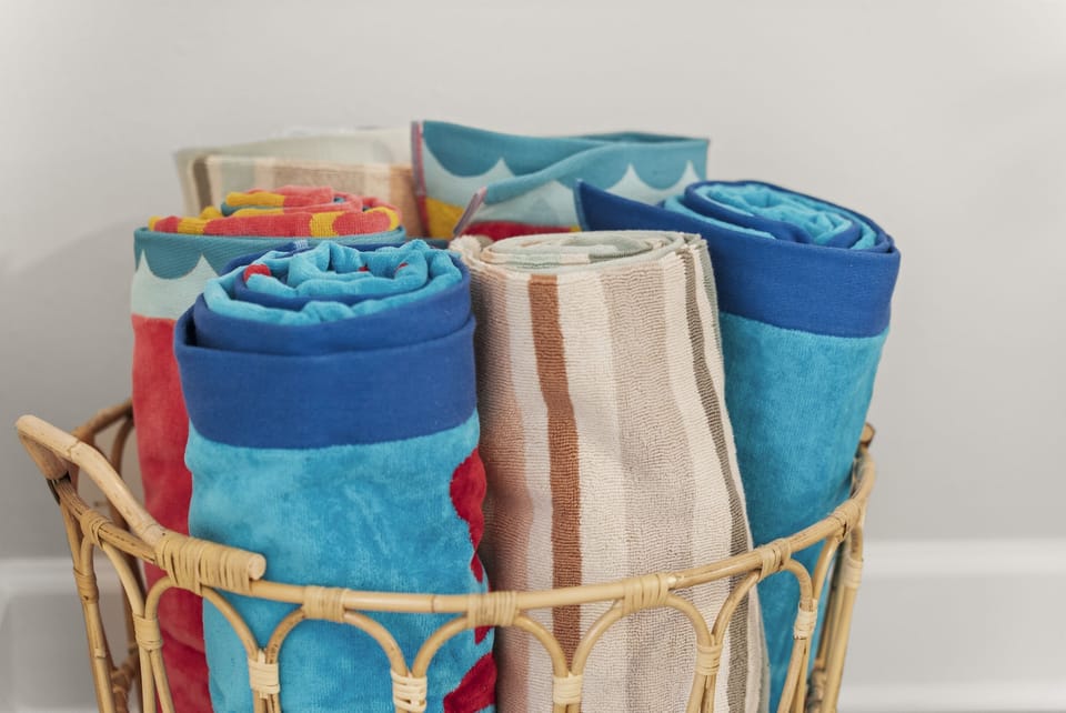 Beach towels provided Fresh colorful beach towels are ready for your coastal adventures offering comfort and convenience for pool days and beach outings.