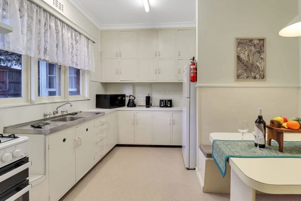 Light-filled kitchen with ample space and everything needed for easy home cooking.