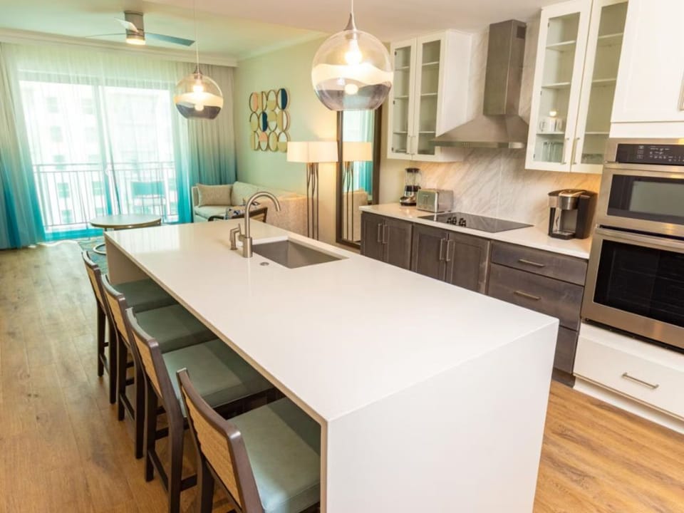 Modern kitchen with a spacious island and high-end appliances, perfect for cooking and dining in.