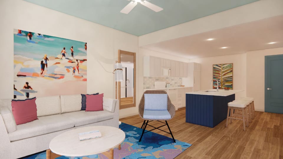 Inviting living room with vibrant decor and comfortable seating, ideal for cozy gatherings.