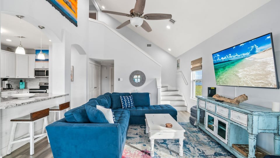 Large living room, couch, and TV!