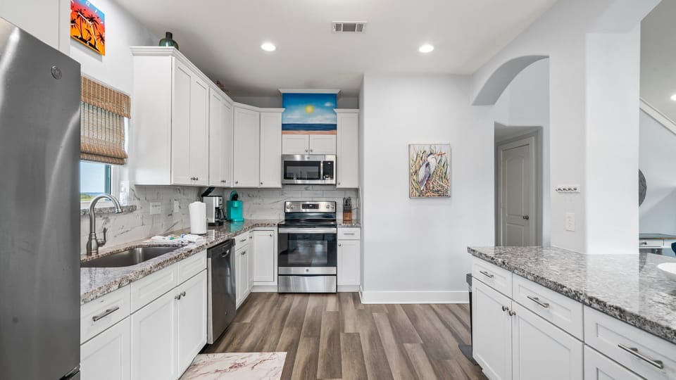 Spacious kitchen w/ modern appliances.