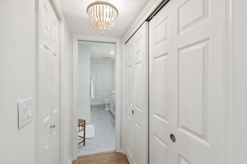 Closet Located in Entry of Primary Ensuite Provides Storage