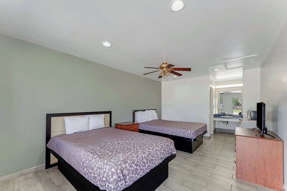 Unit with 2 Double beds. Exact unit will be assigned upon arrival. Views, colors, and decor may vary.