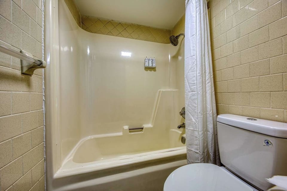 Rinse off after adventures in a clean tub-shower combo.