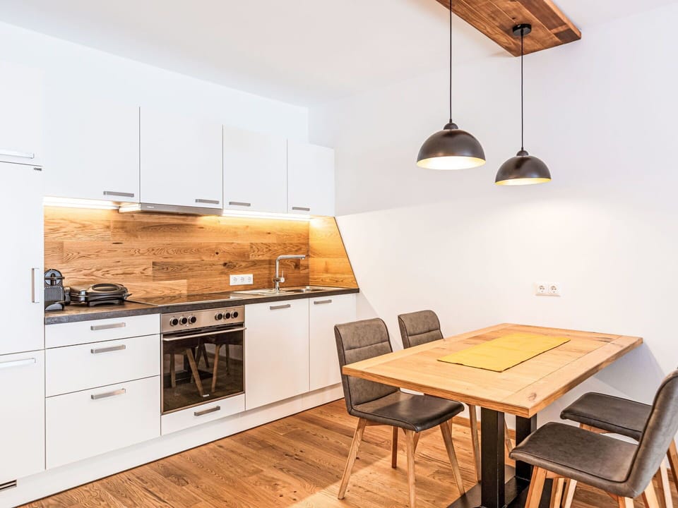 Furniture, Property, Cabinetry, Table, Countertop, Wood, Interior Design, Lighting, Kitchen Stove, Kitchen