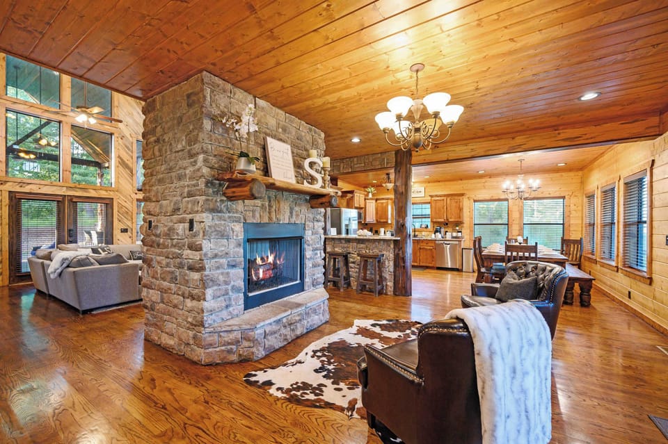 Gather in the cozy sitting area beside the living room, complete with a warm fireplace.