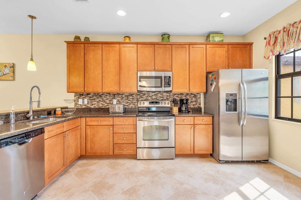 The kitchen has a stainless steel appliance package and has views to the quad 