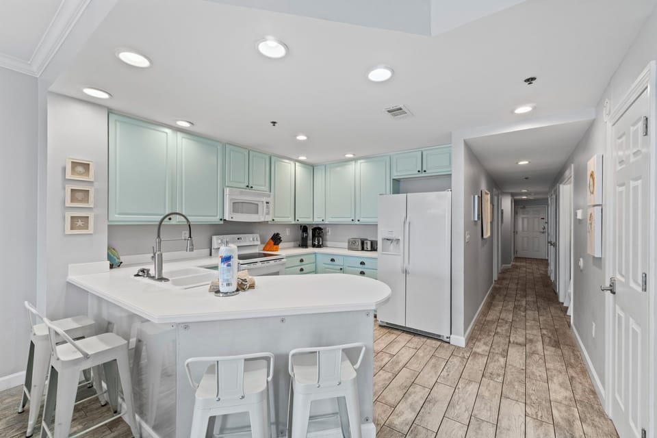 There is additional bar seating in the kitchen