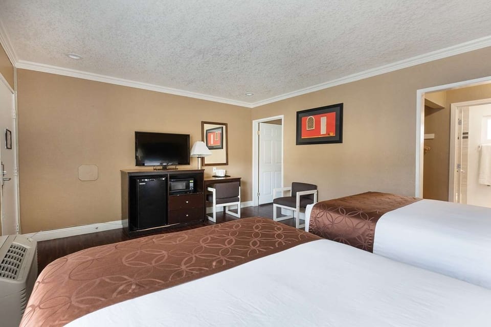 Settle in with TV, mini-fridge, and an easy workspace.