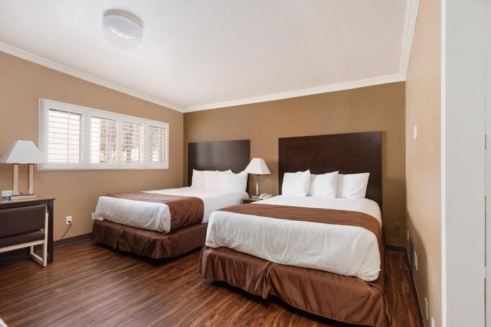 Drift off in crisp linens within a calm, quiet room.