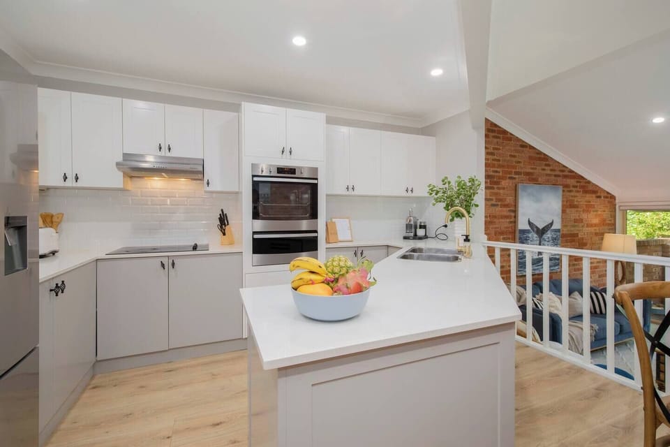 Spacious kitchen with modern appliances, perfect for preparing meals during your stay.
