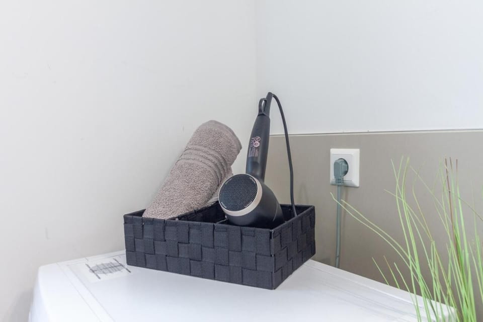Sufficient towels are available, as well as a hairdryer and clothes rack
