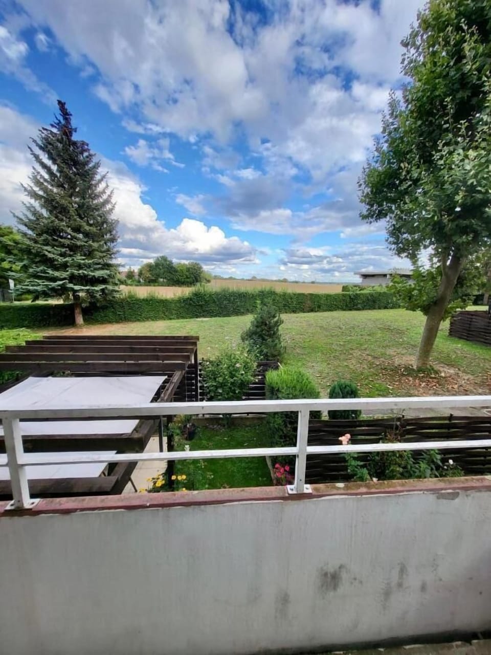 Our balcony with seating area and view of the fields