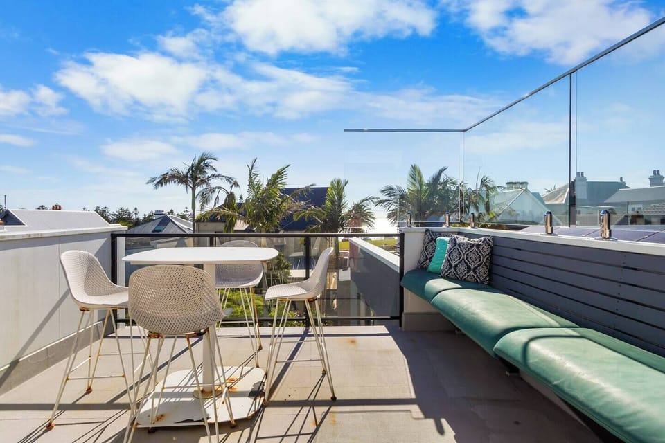 Soak up the sun and views from the private rooftop terrace, complete with outdoor seating and dining amenities.
