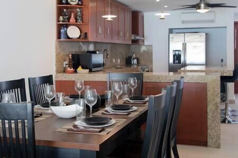 The dining room easily accommodates 8 people at the table.
