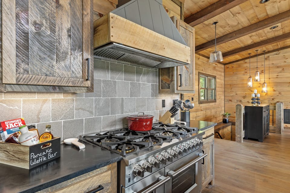 The kitchen featuring an 8 gas stove top