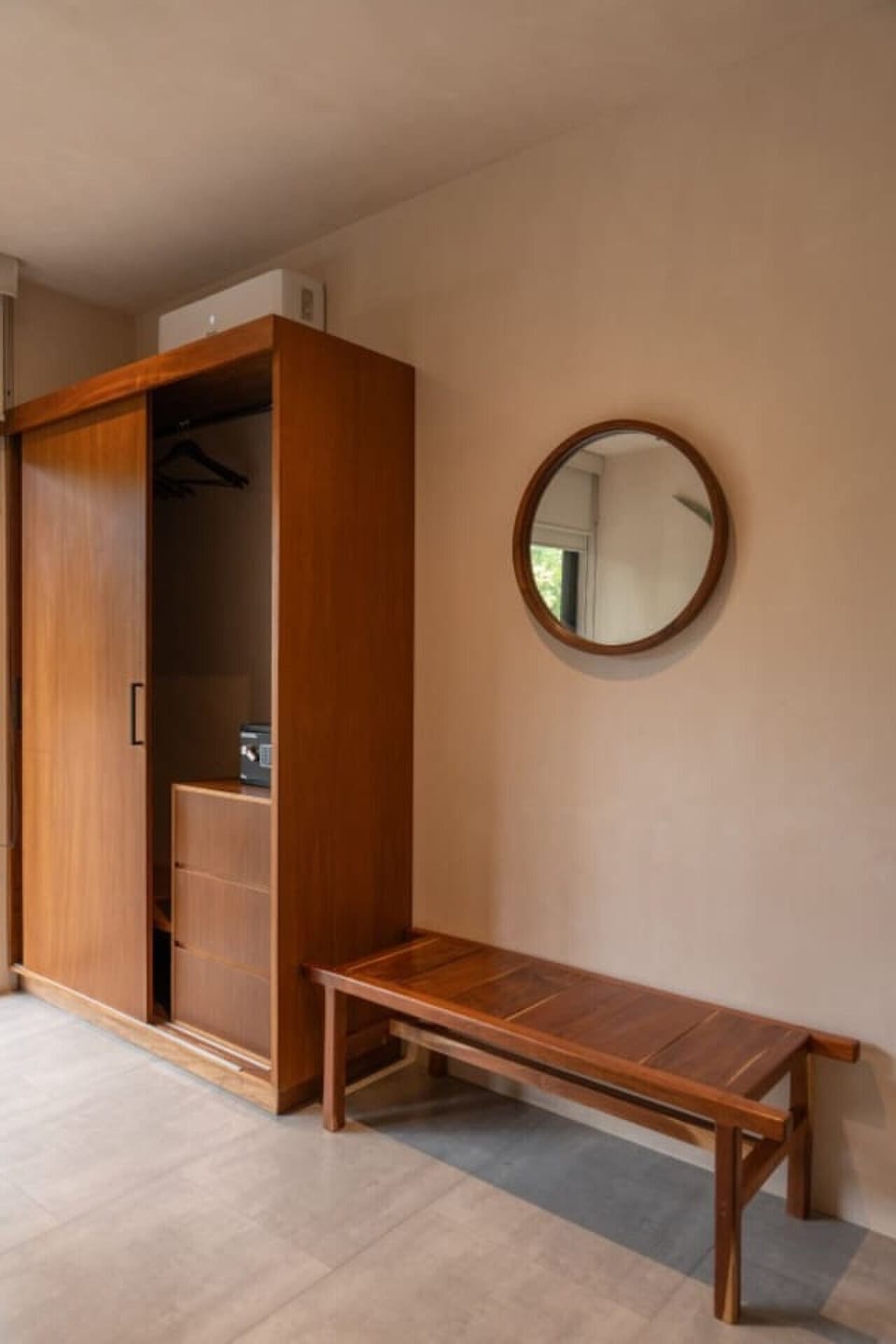 Minimalist wardrobe w/ wood closet, mirror & cozy bench