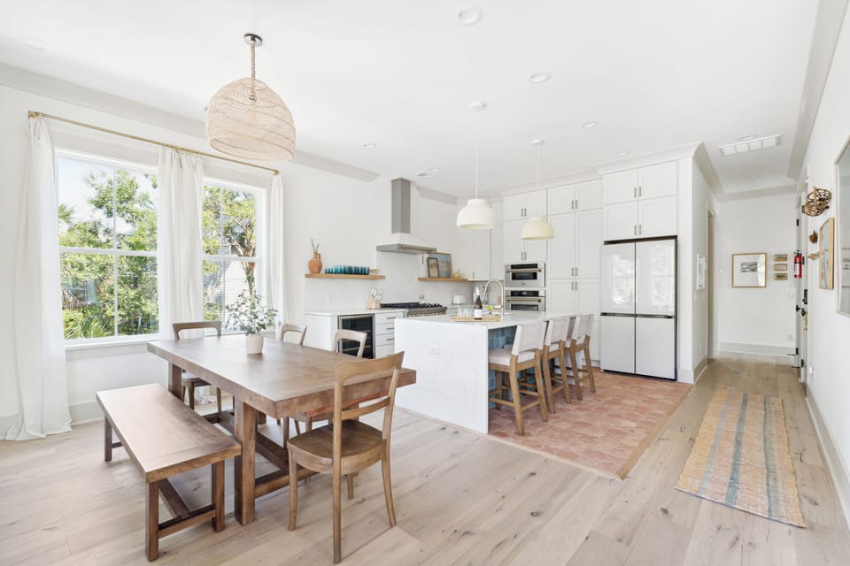 Dining table and kitchen.