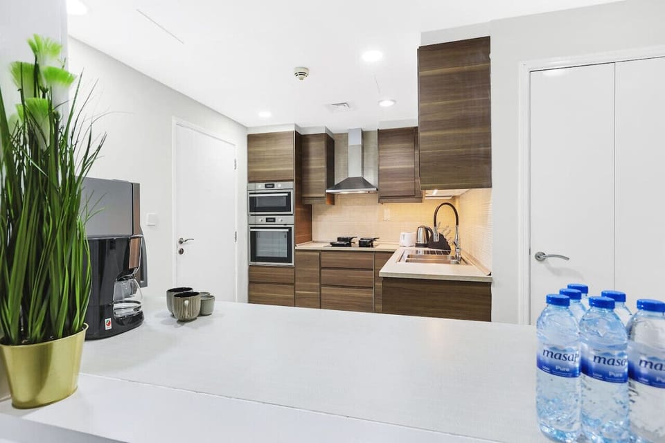Kitchen: Whip up culinary delights in this sleek, modern kitchen with premium appliances!