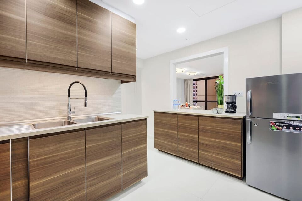 Kitchen: Chef`s paradise with sleek cabinetry, modern appliances, and a vibrant view beckoning!