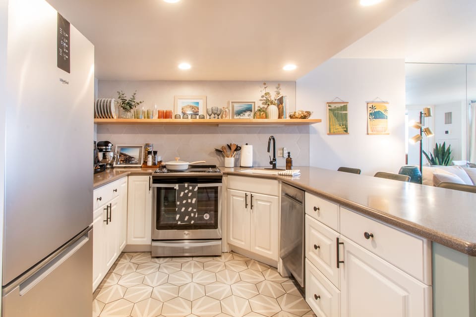 Full kitchen with stove, oven, stainless steel refrigerator freezer (brand new), microwave, Nespresso coffee maker (pods included), KitchenAid stand mixer, cooking pan, dishware, utensils and basic cooking supplies.