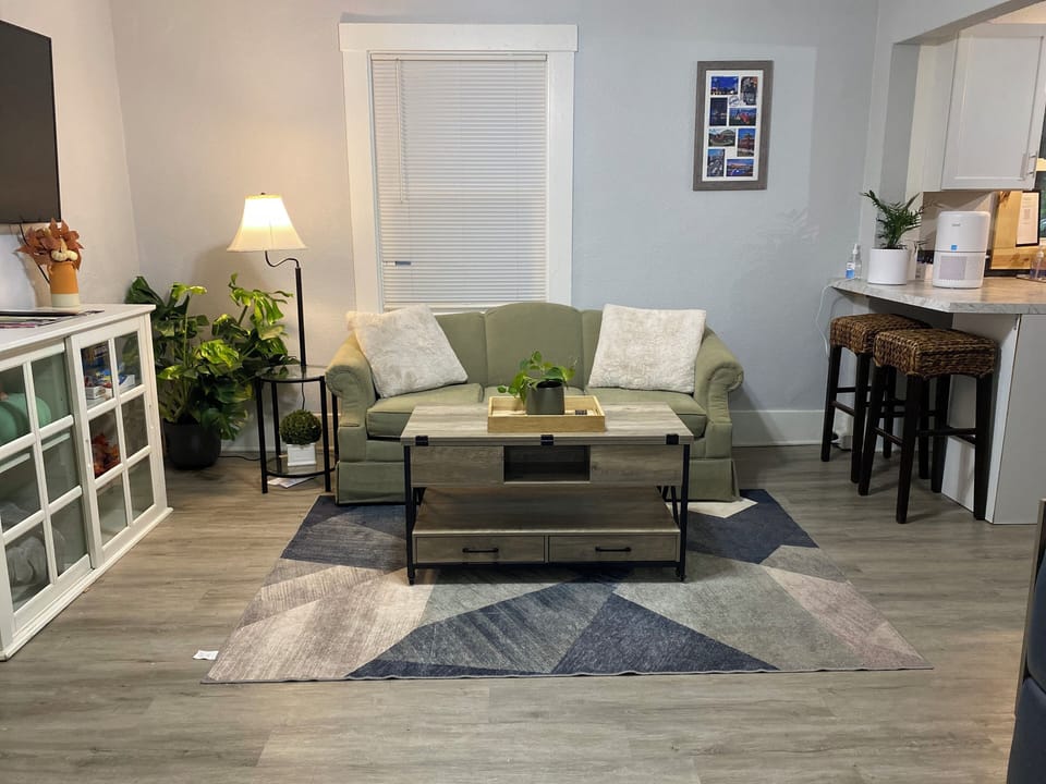 Bright, open-concept living space with smart TV & comfy seating