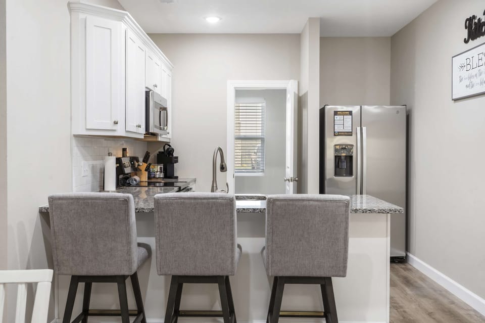 The open, airy kitchen offers ample space & every home comfort
