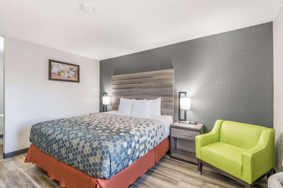 Recharge in a calm room with cozy seating and soft lighting.