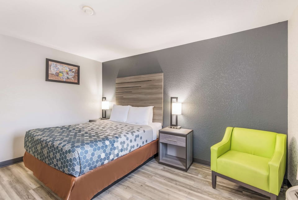 Relax into crisp linens and calming, modern wall accents.