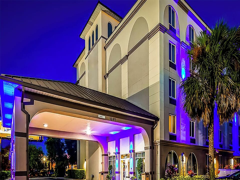 Arrive in style under glowing lights and welcoming arches.