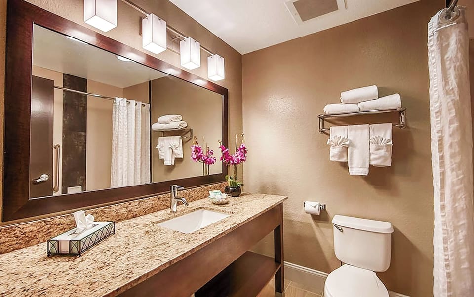 Refresh easily with bright vanity lighting and plush towels.