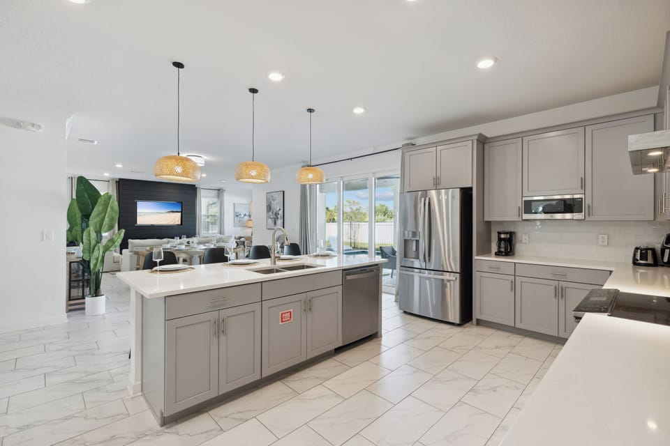 Modern kitchen with sleek appliances and ample space for cooking.