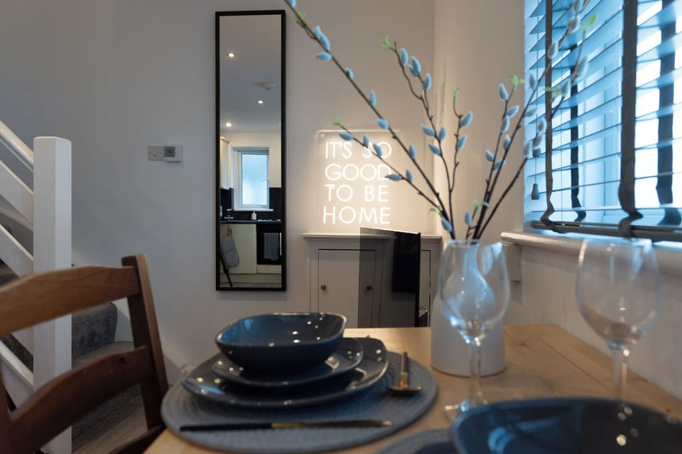 Dining table with wine glasses and mood lighting in the living room