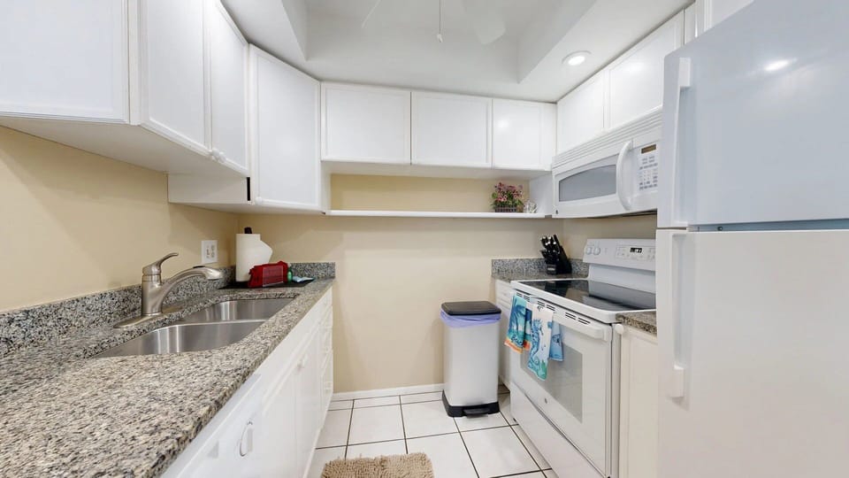 Kitchen is fully stocked with all your cooking needs.