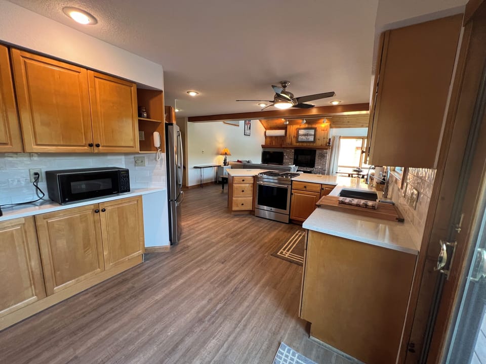 Living area. New floors.  New furniture. Smart TV. High end downdraft Jenn air