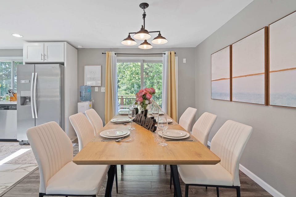 Elegant dining setup with ample natural light from the sliding glass doors.
